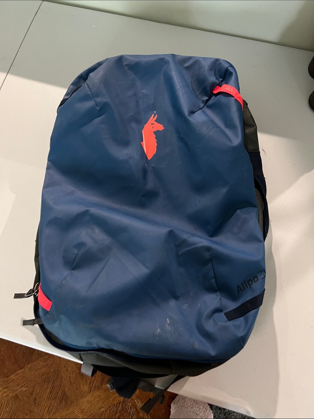 cotopaxi Blue Backpack with Orange Logo